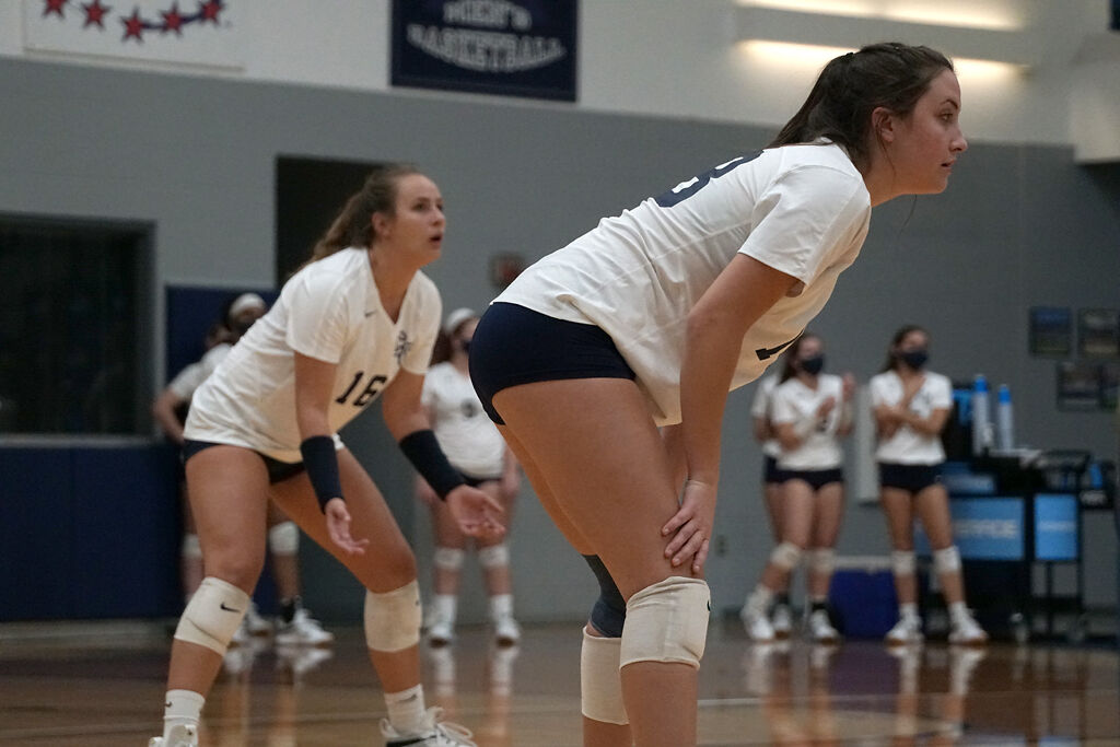 Columbia College outside hitter Sidney Branson, left, and middle hitter Erika Miller prepare for a serve on Monday at Southwell Complex.